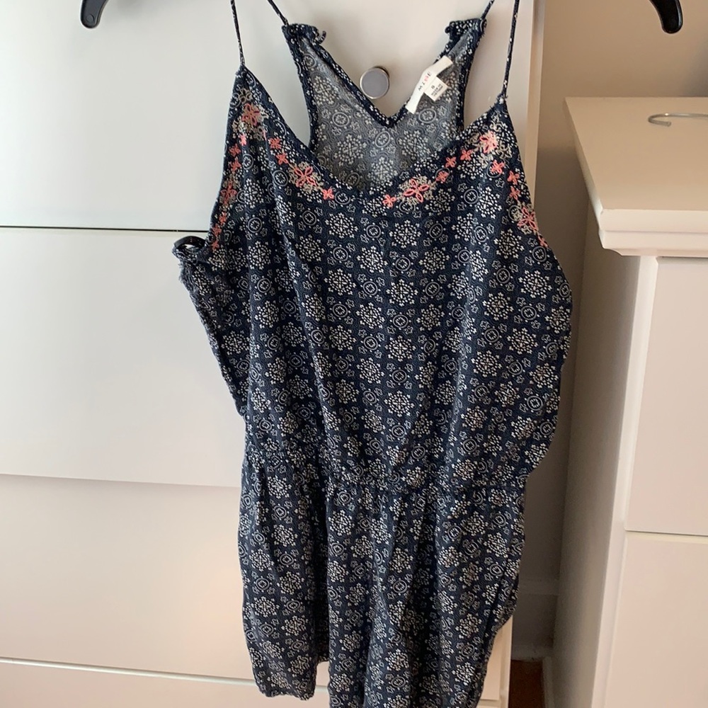 Blue romper with white design